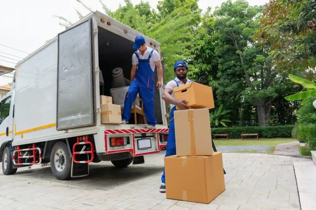 Our expert moving services in south miami fl crew loading boxes into moving truck.